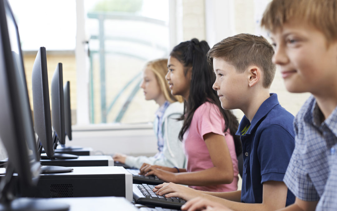 Children using keyboarding program for students on computers